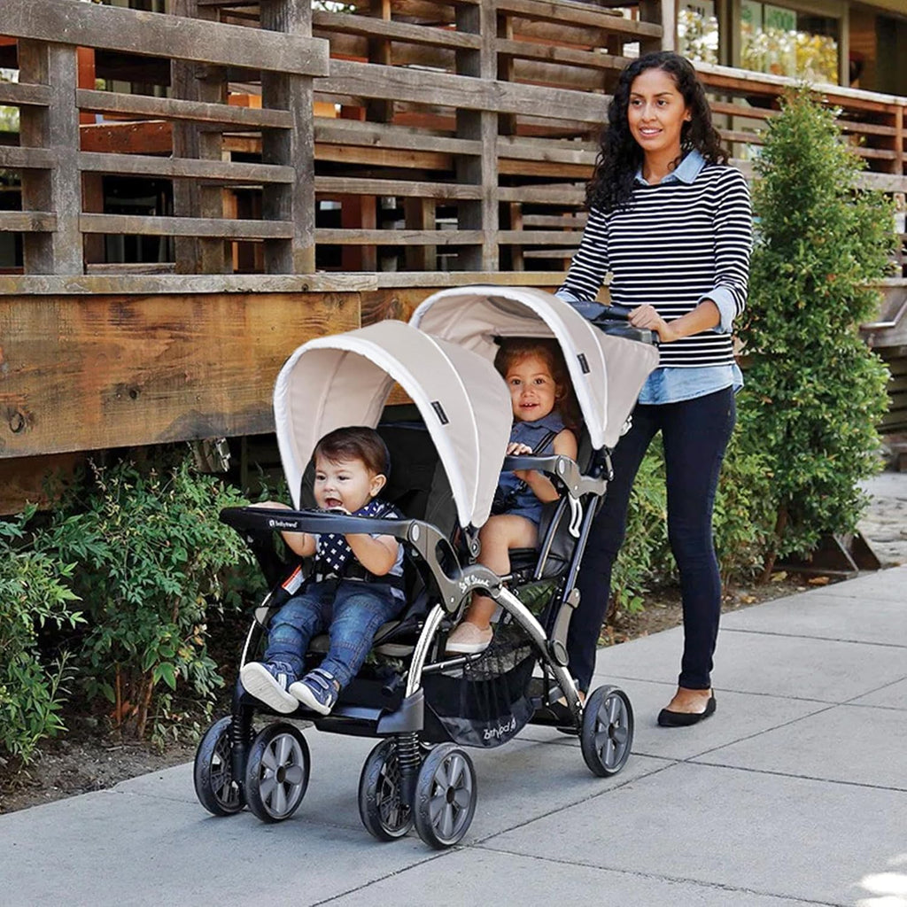 Baby Trend Double Infant and Toddler Stroller w/ Harness and Basket, Sit N' Stand, Khaki