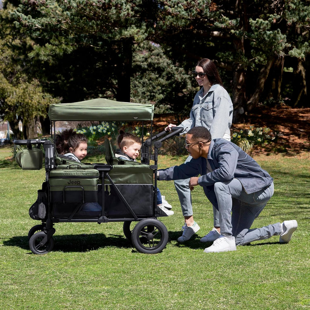 Delta Children - Jeep Wrangler Deluxe 4 Seater Stroller Wagon - Premium Quad Stroller Wagon for 4 Kids with Convertible Seats, Adjustable Push/Pull Handles, Removable Canopy & Flat Fold, Black/Green